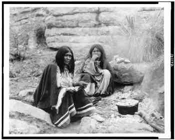 Two Apache Indian women at campfire